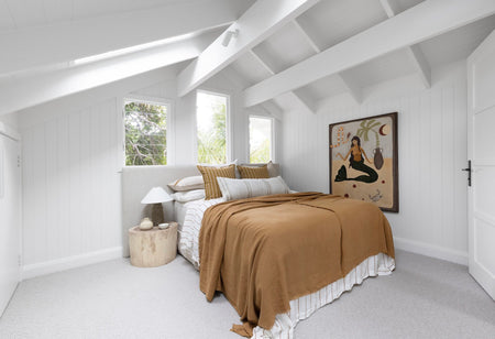 Long Time Bed Head in coastal bedroom draped in terracotta linen