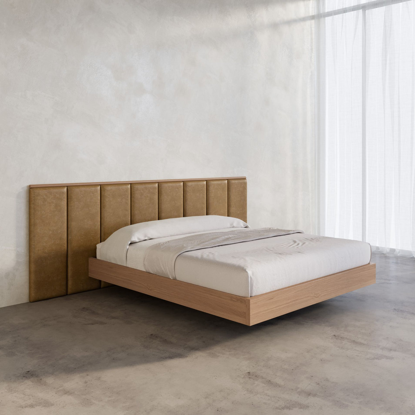 Leather bed frame with timber floating bed base in a large micro cement walled bedroom