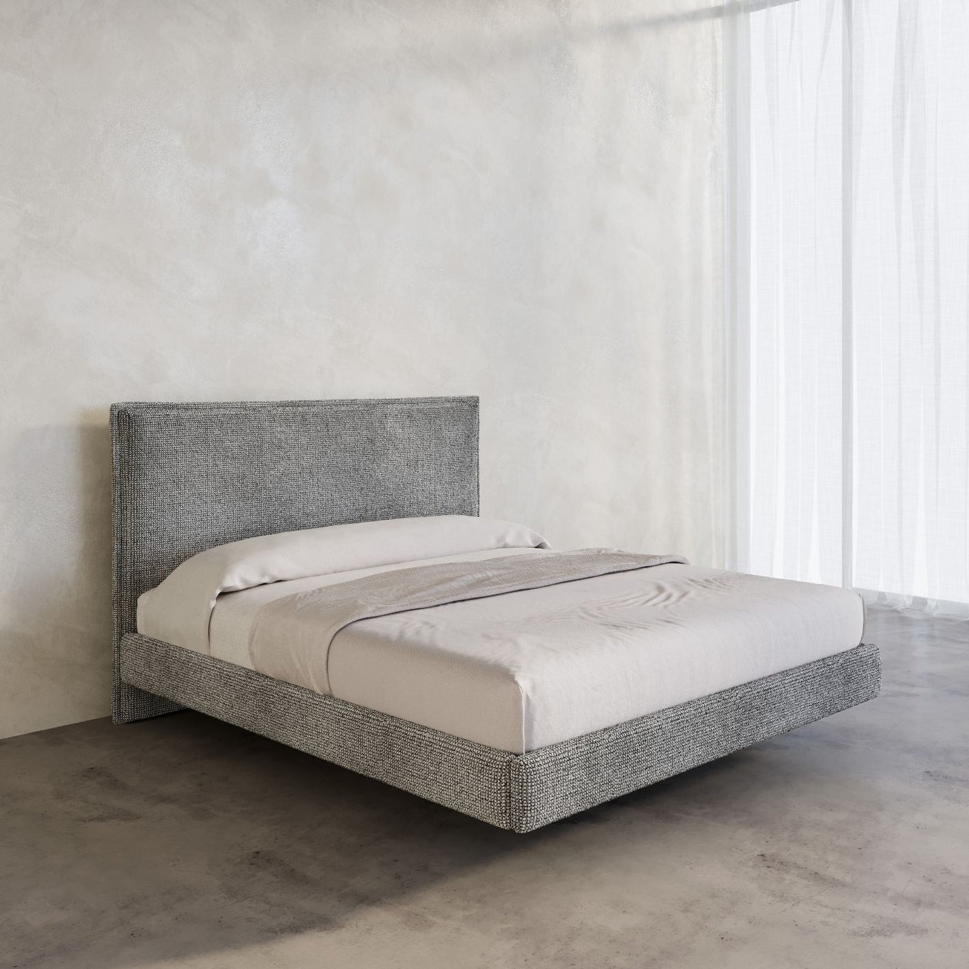 Stockholm Bed Frame in a chunky grey Wool Fabric pictured in a high end room with micro cement walls