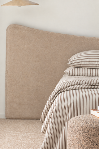 Oversized Ace Bed Frame  with striped chocolate and white sheets