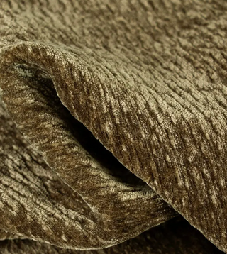 Close-up of textured green velvet fabric