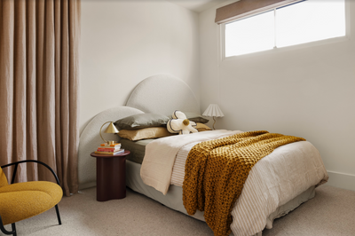 boucle bed head in white pictured in a modern kids bedroom